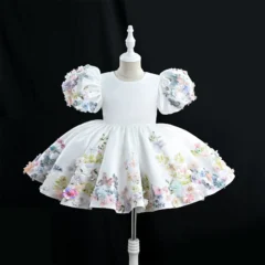 Luxurious white girls' flower girl dress features 3D floral embroidery and puff sleeves.