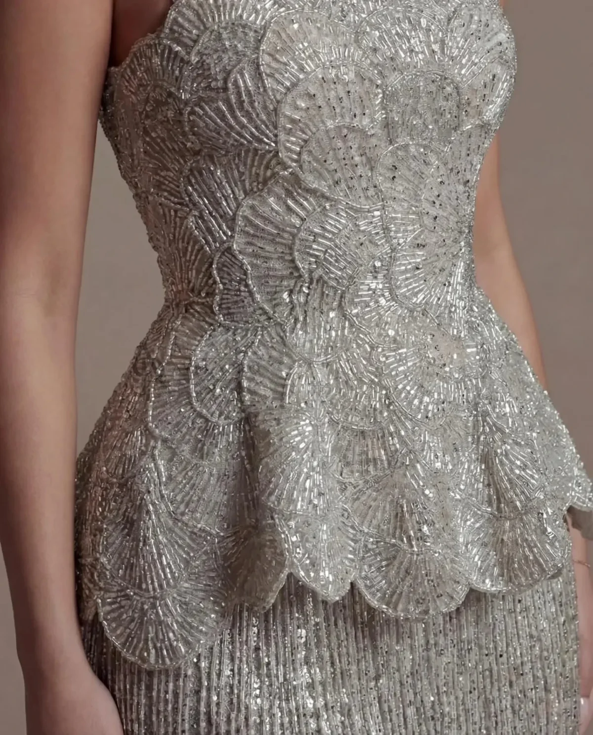 Elegant Gray Strapless Evening Dress with Scalloped Peplum Waist and Long Beaded Fringe
