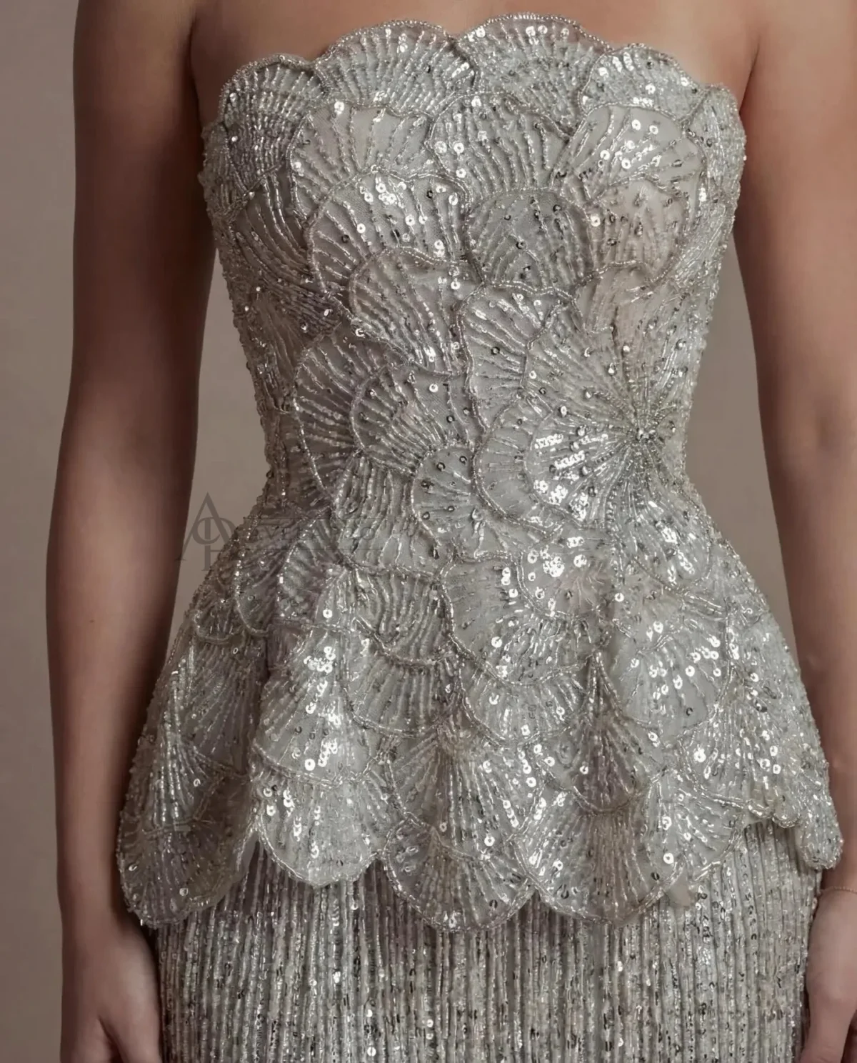 Elegant Gray Strapless Evening Dress with Scalloped Peplum Waist and Long Beaded Fringe