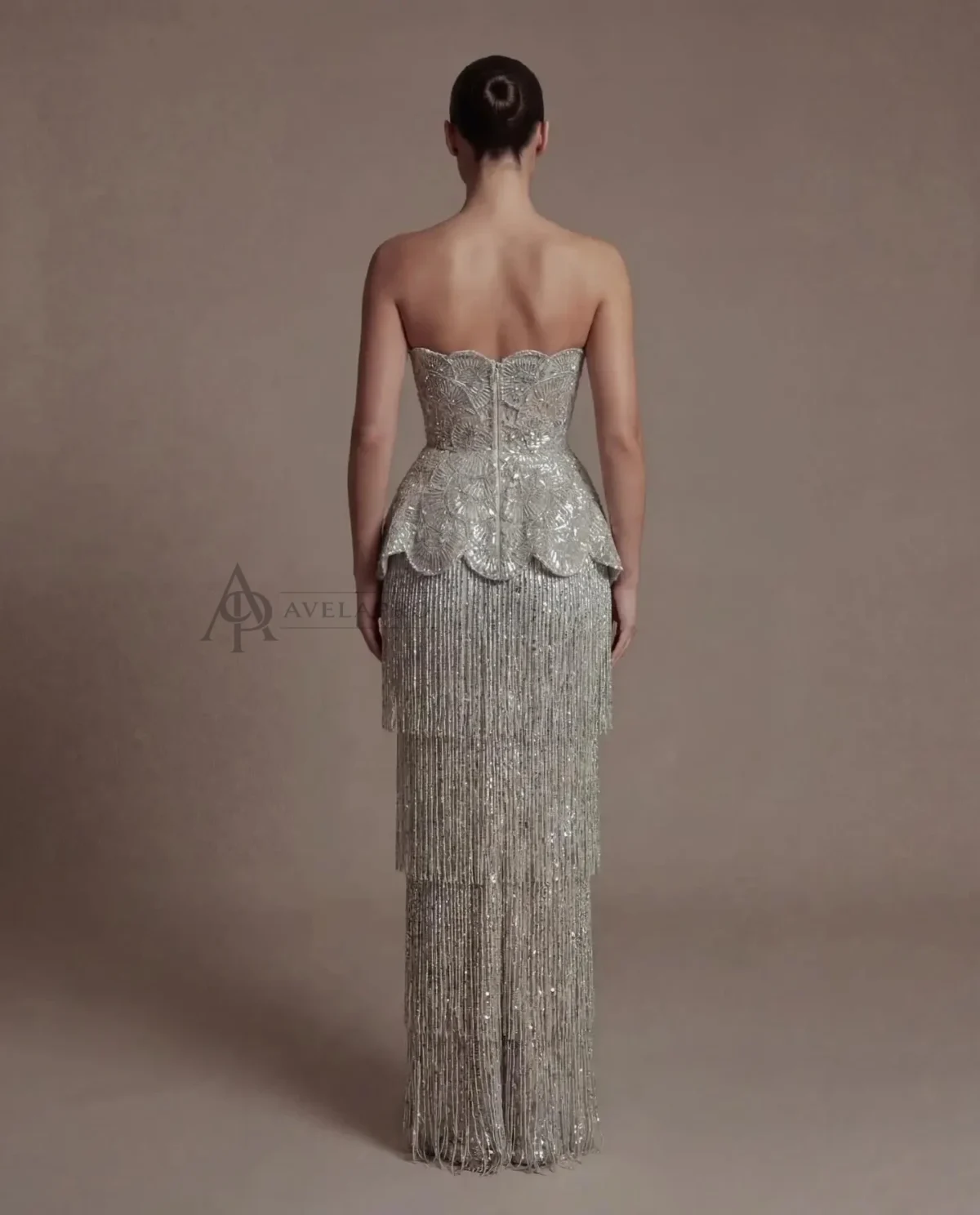Elegant Gray Strapless Evening Dress with Scalloped Peplum Waist and Long Beaded Fringe