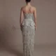 Elegant Gray Strapless Evening Dress with Scalloped Peplum Waist and Long Beaded Fringe