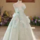 Elegant Mint Green Princess Dress with Floral Details and Sparkling Tulle