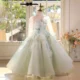 Elegant Mint Green Princess Dress with Floral Details and Sparkling Tulle