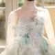 Elegant Mint Green Princess Dress with Floral Details and Sparkling Tulle