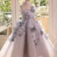 Elegant Mint Green Princess Dress with Floral Details and Sparkling Tulle